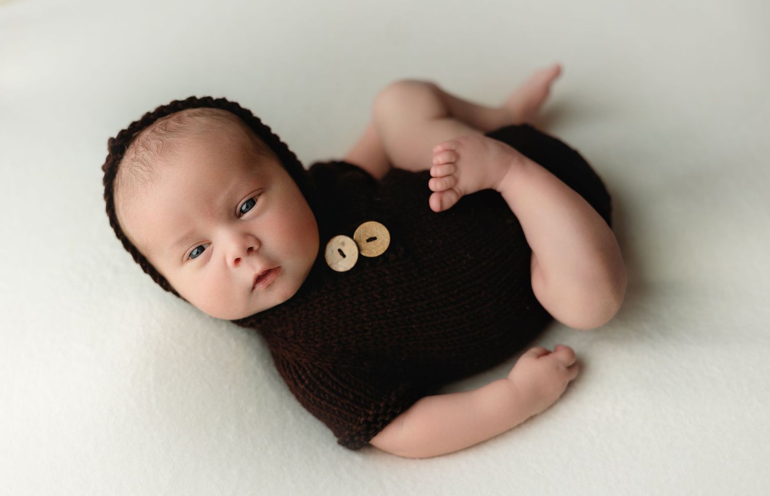A wide awake newborn boy in a brown outfit. Greenville SC newborn photographer, Easley, SC newborn photographer, Upstate SC newborn