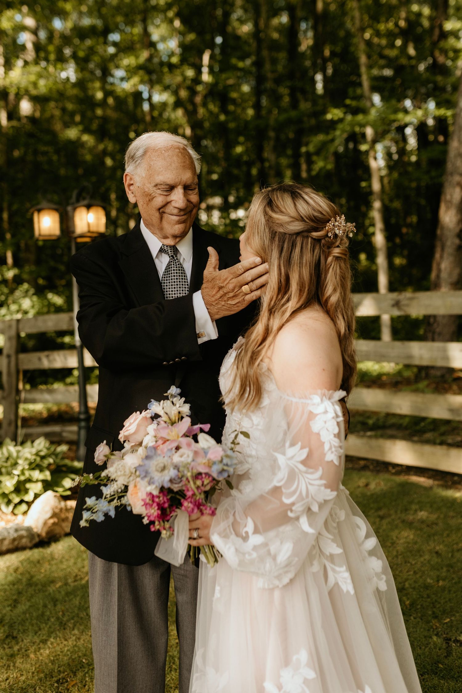 Bride at the barn at big oak in franklin, georgia with her grandpa during family portraits