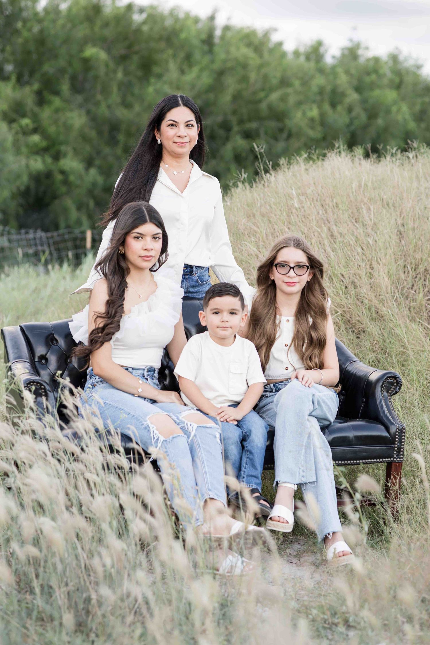 A beautiful outdoor family portrait session in Holly Springs, NC, capturing the unique bond between parents and children