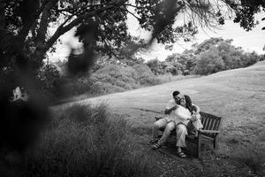Black and white wedding photography sequence captured in a natural outdoor setting.