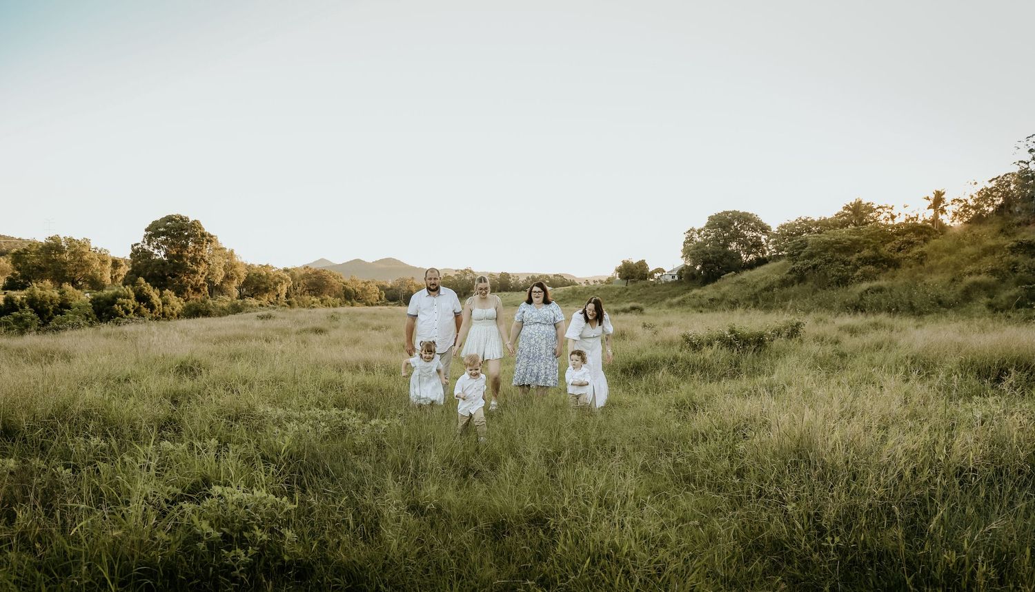 Family group walking in a paddock