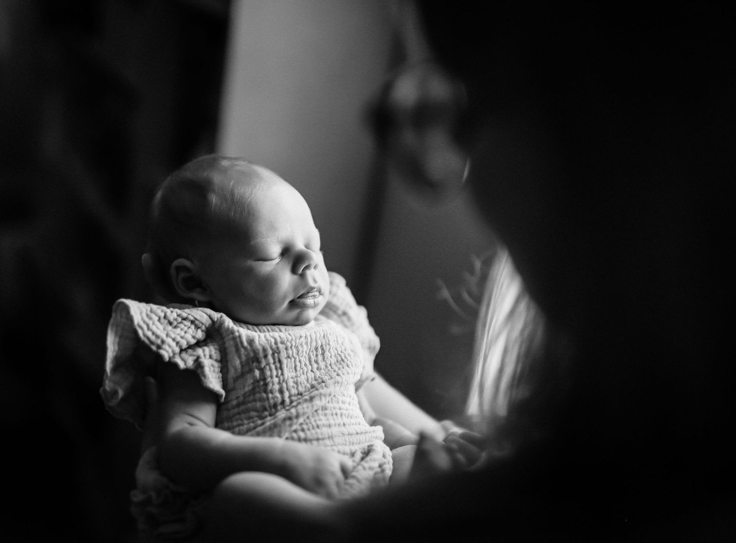 In-home lifestyle session mama holding baby girl