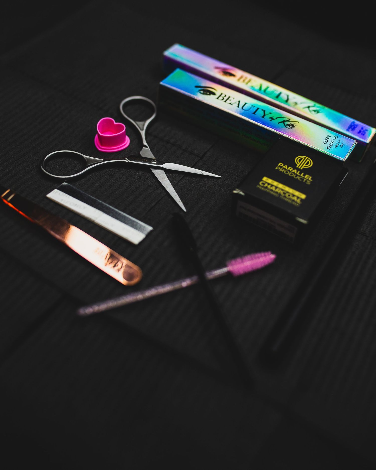 "Flat lay of professional lash extension tools and packaging – aesthetic product photography for beauty and lash brands"