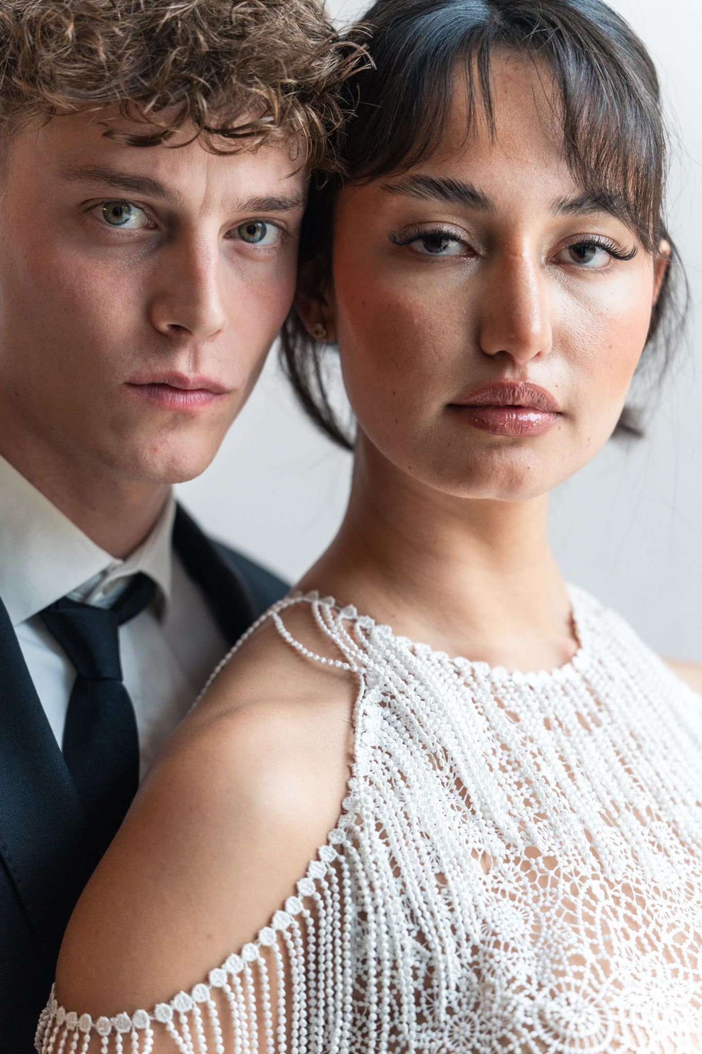 Close-up fashion portrait showcasing elegant bridal wear and formal styling. Next day wedding photography.
