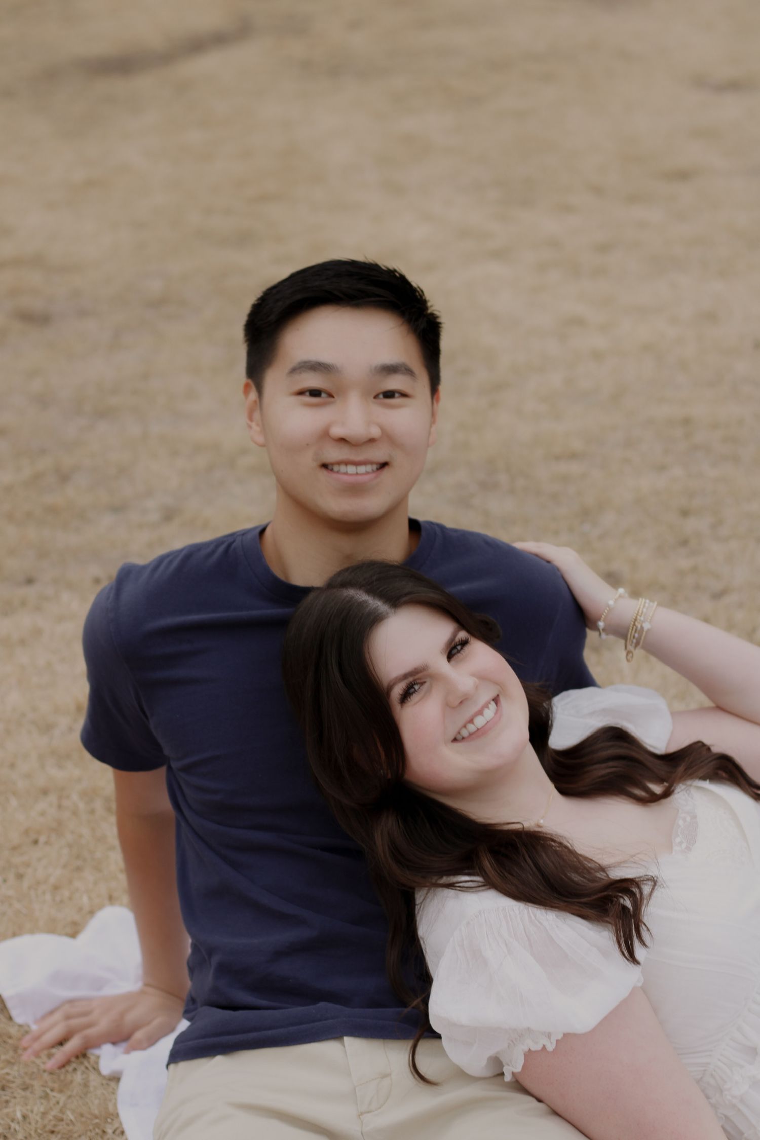 Couples photos, couples photo at the park, birmingham botanical gardens, couple laying on top of eachother