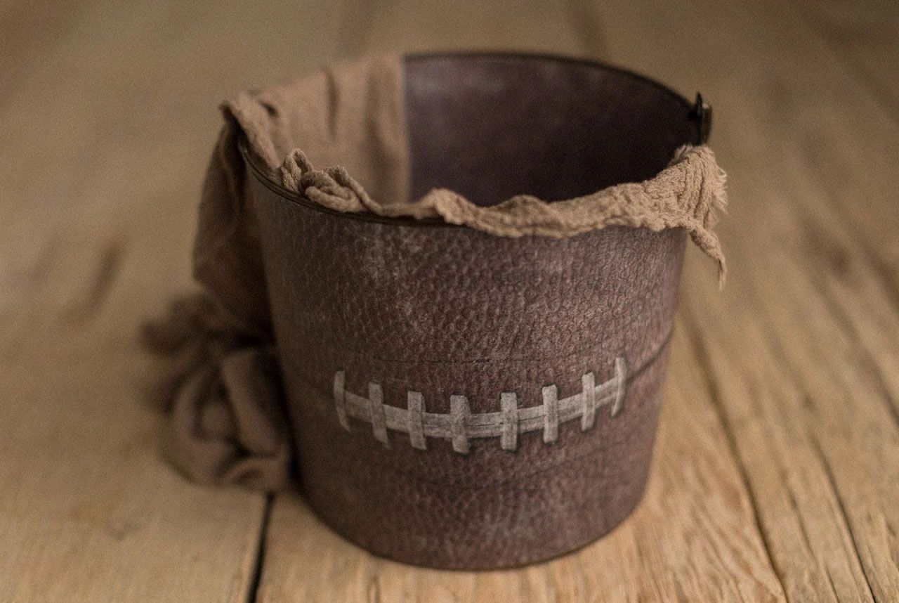 A ceramic bowl with an American flag pattern sits on a rustic wooden table surface.