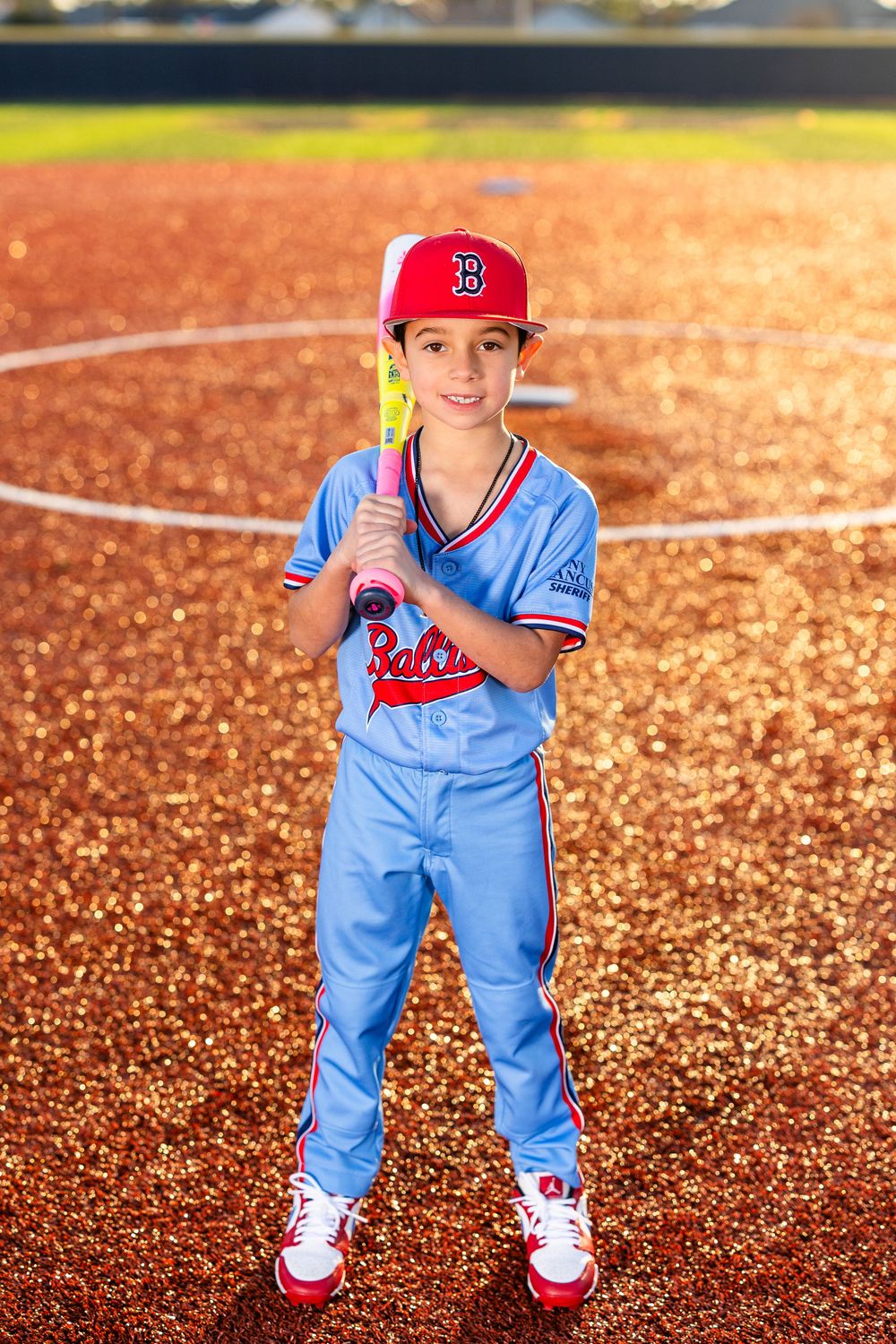 Youth baseball portrait using off-camera flash during a team media day in Lake Charles, LA. Ballistics at Westlake High School Field