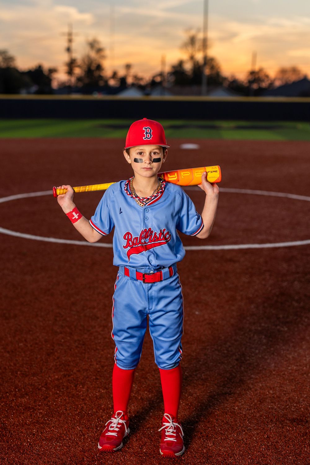 Youth baseball portrait using off-camera flash during a team media day in Lake Charles, LA. Ballistics at Westlake High School Field