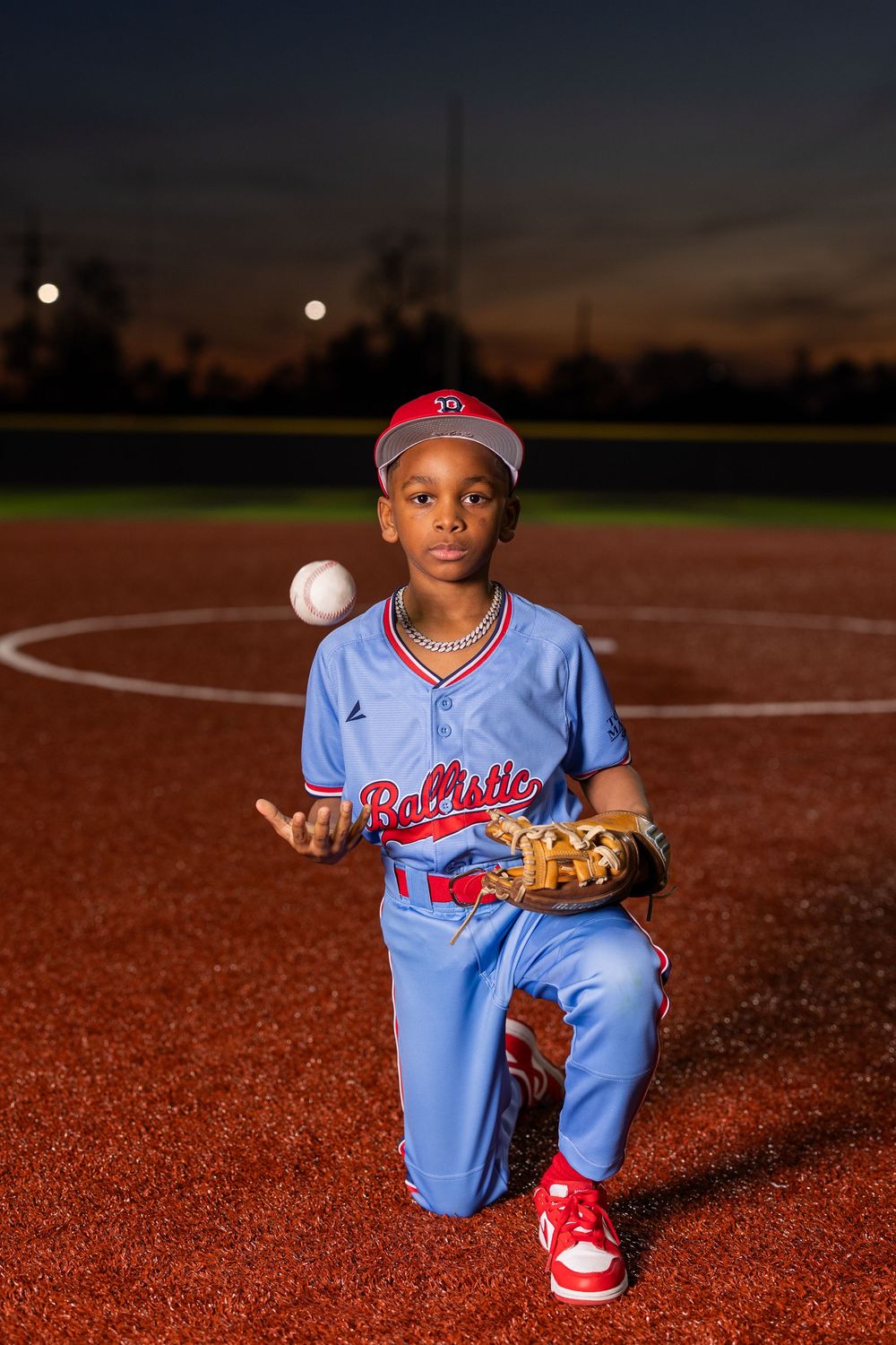 Youth baseball portrait using off-camera flash during a team media day in Lake Charles, LA. Ballistics at Westlake High School Field