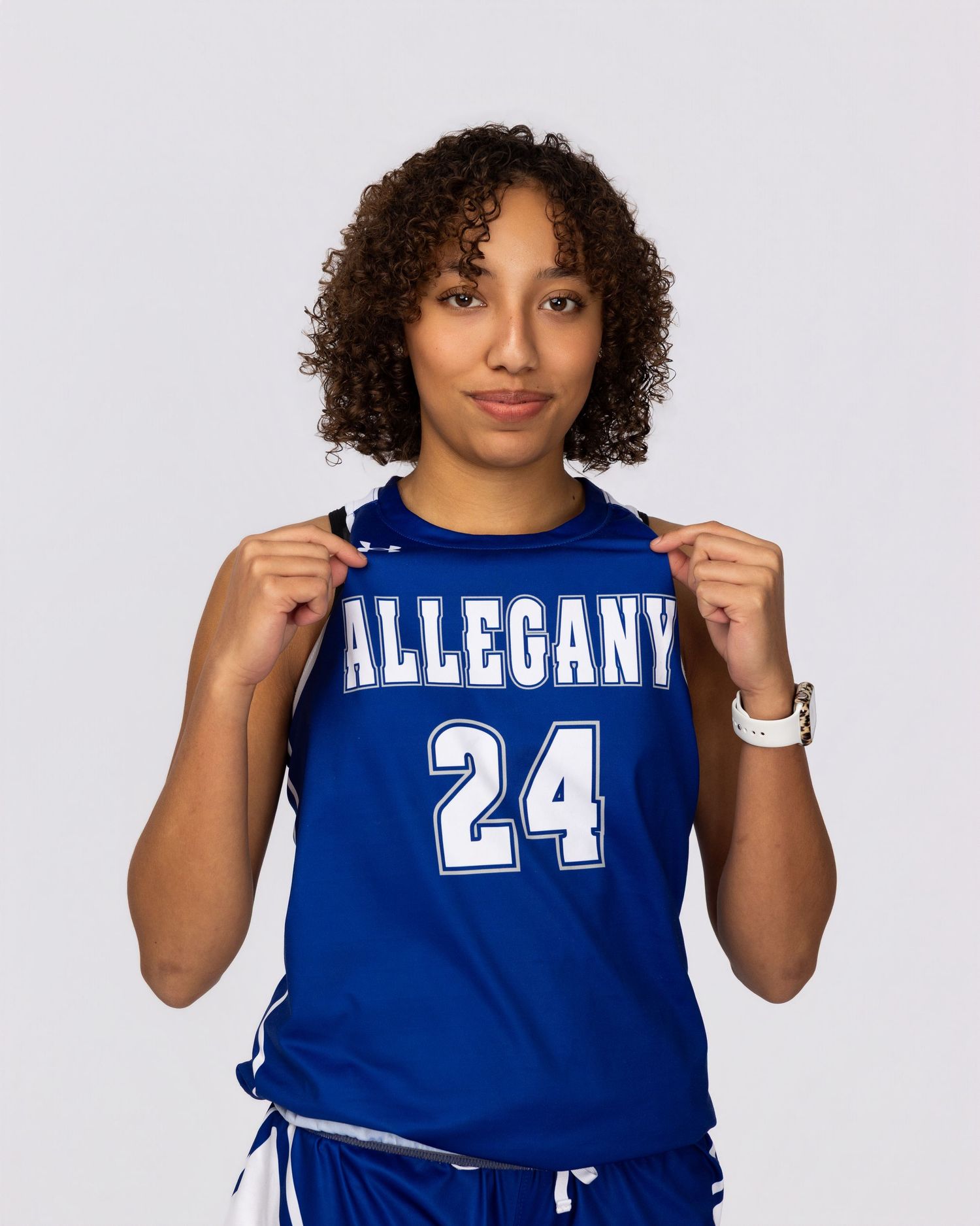 Person wearing a blue basketball jersey with number 24 and "ALLEGANY" text in white lettering.