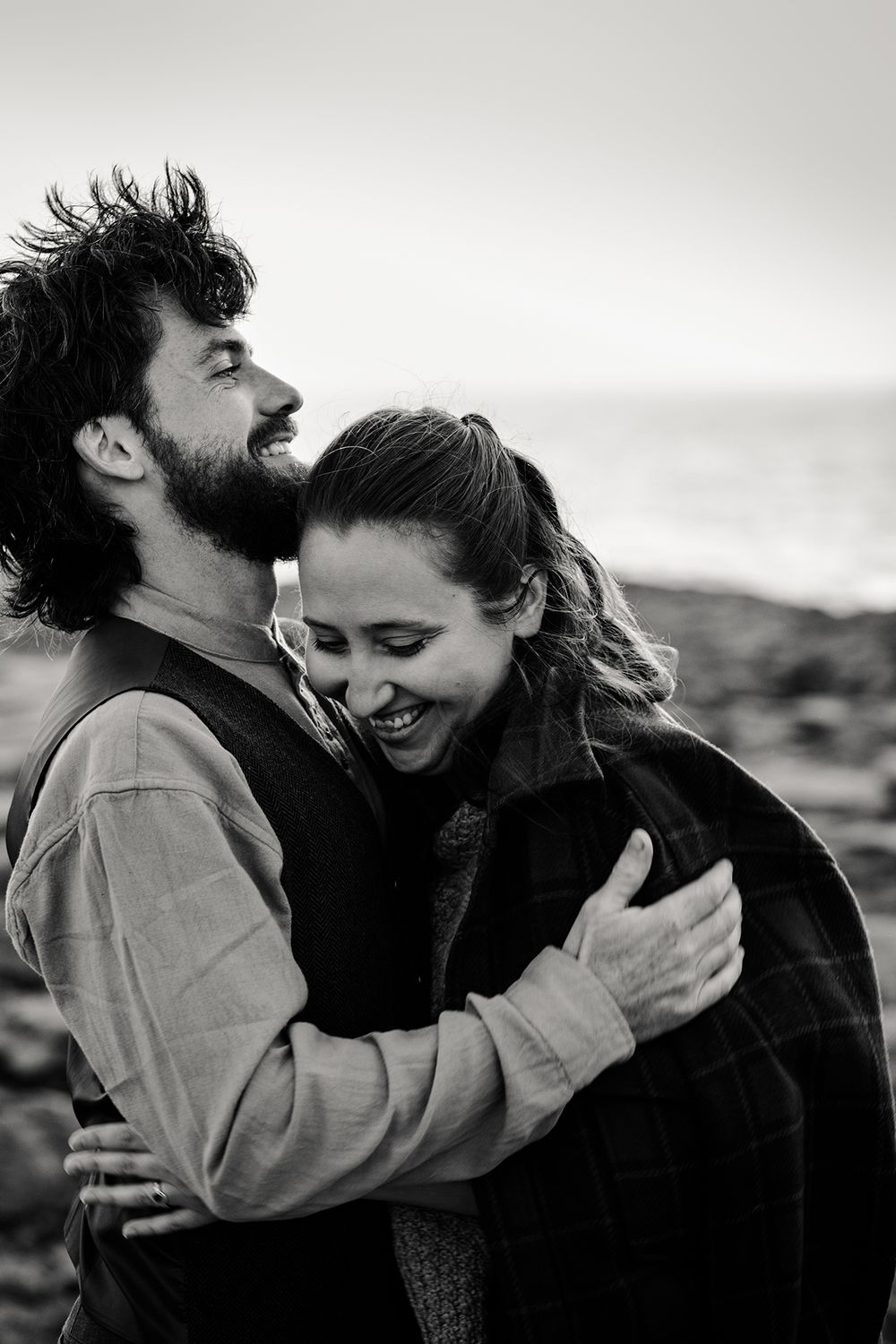 Couple embracing during sunset portraits at the Burren after their Ireland elopement ceremony