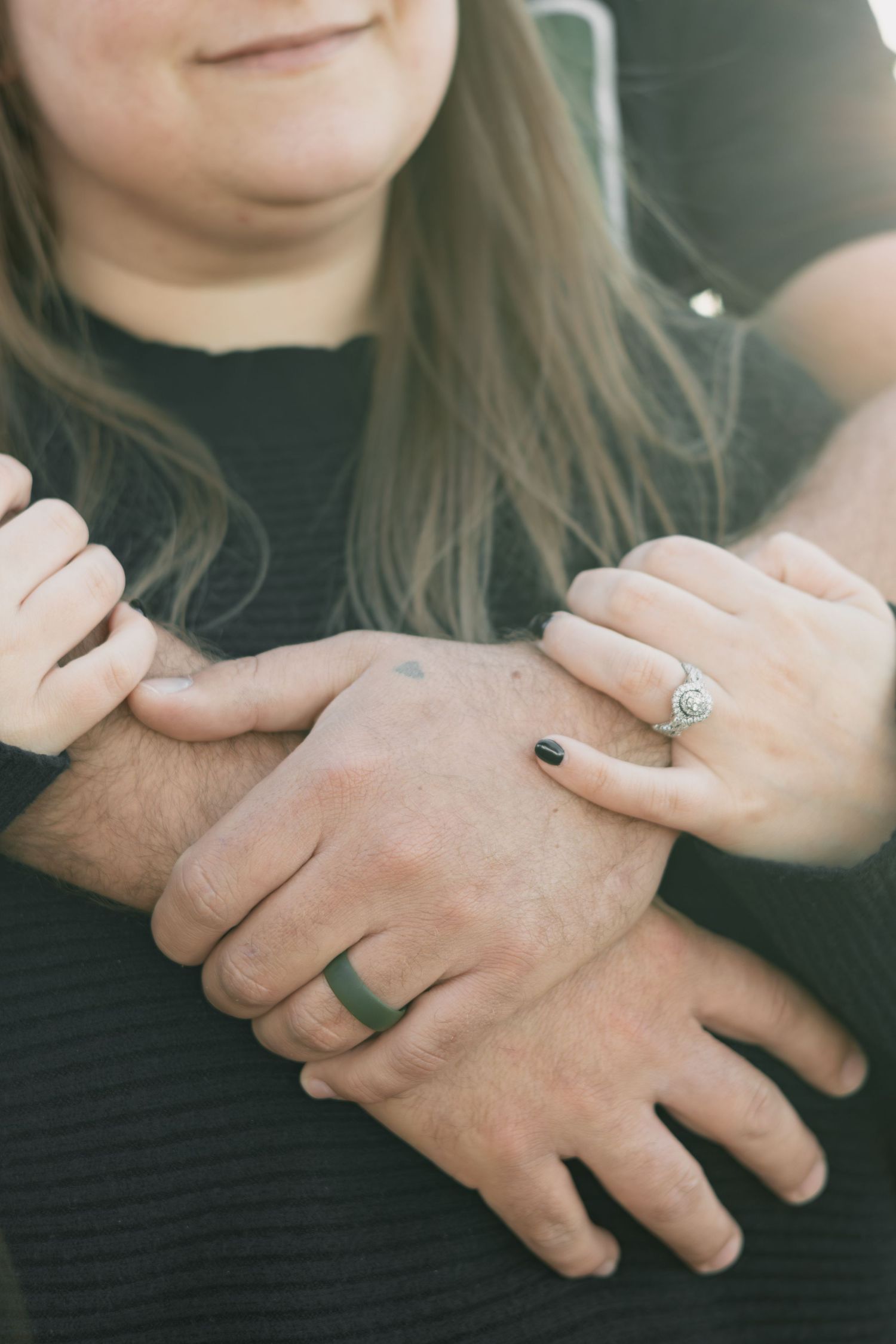 A series of close-up photos showing hands with engagement rings and wedding bands in different poses.