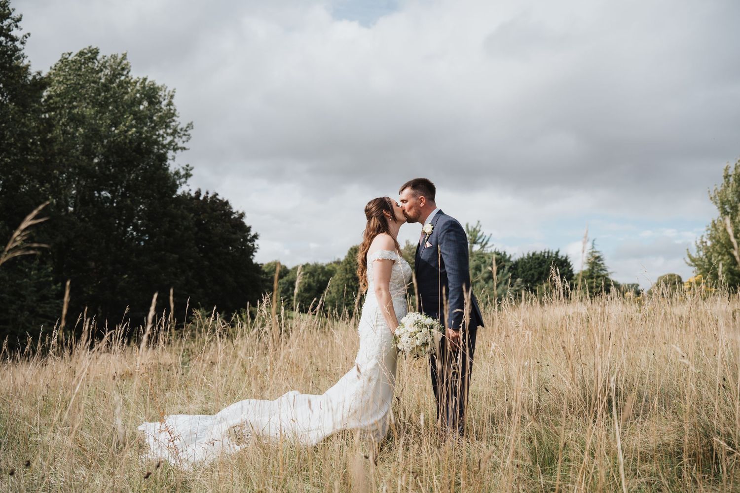 The Cotswold Hotel Wedding Photography Bride & Groom kiss