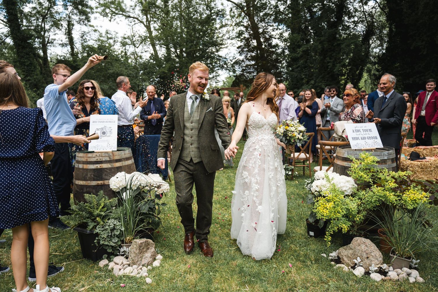 Brightwell Vineyard Wedding Photography with outside ceremony with bride, groom and guests