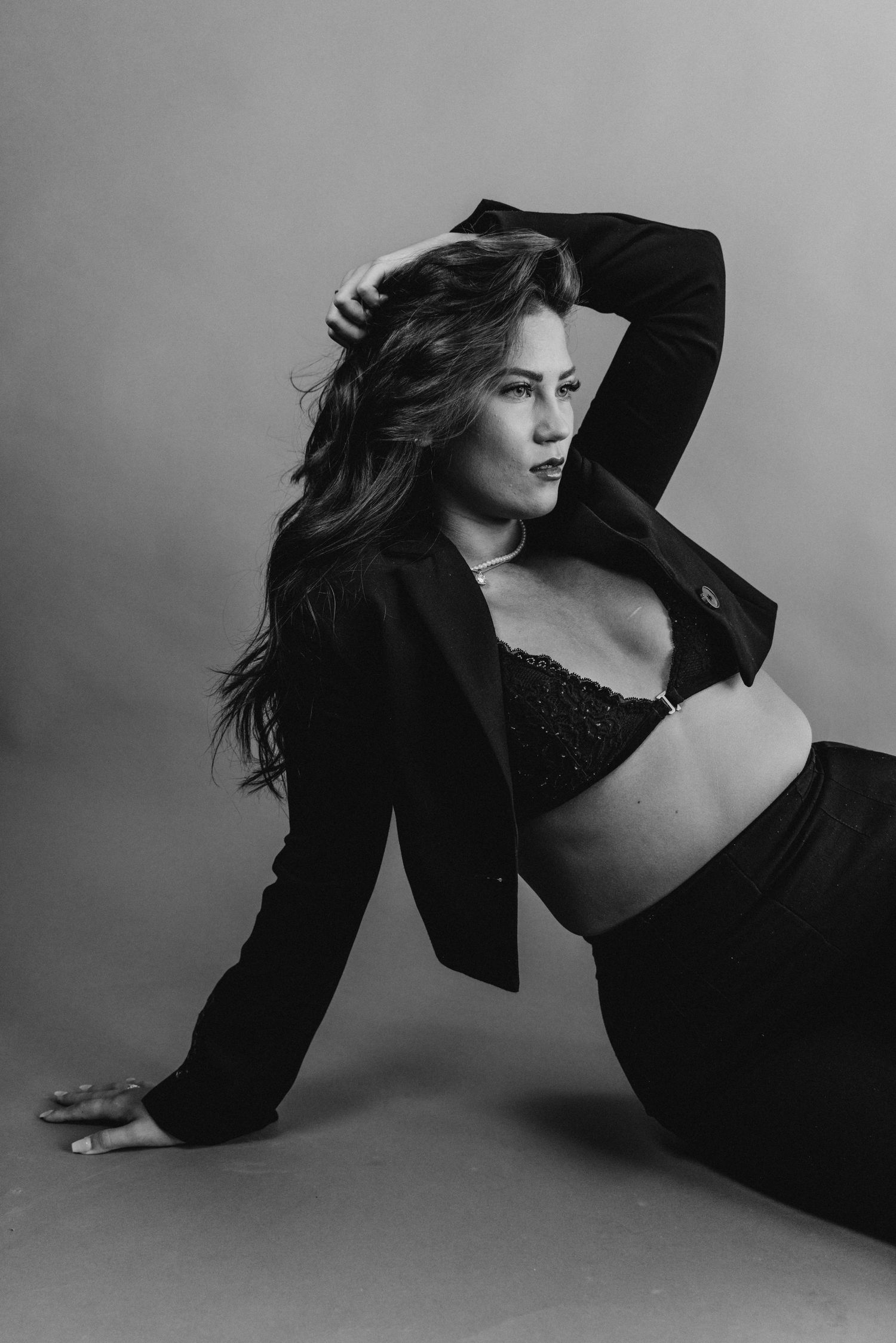 Artistic black and white fashion photo series showing dynamic poses against light background.
