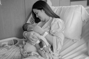 Black and white series of photos showing tender moments between parent and newborn in hospital setting.
