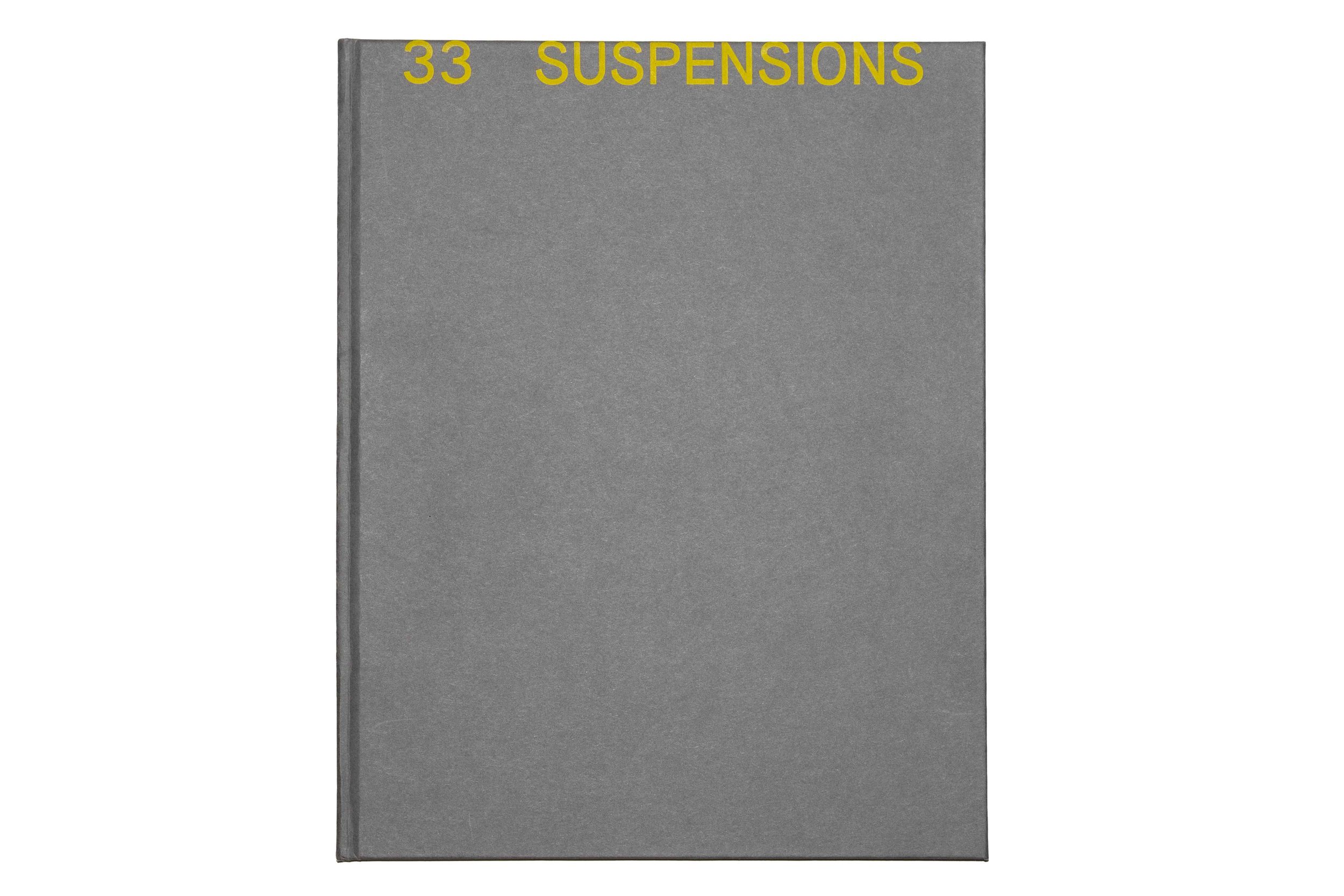 Gray book cover with yellow text reading '33 SUSPENSIONS'.