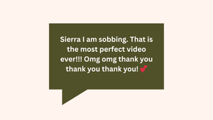 A dark green text message bubble containing enthusiastic feedback about a video on a light pink background.