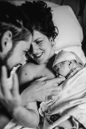 Black and white image showing an intimate medical moment.