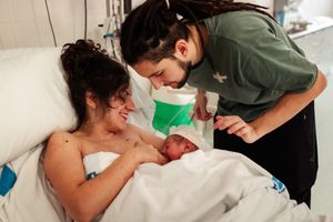 Healthcare providers working together during a medical procedure.