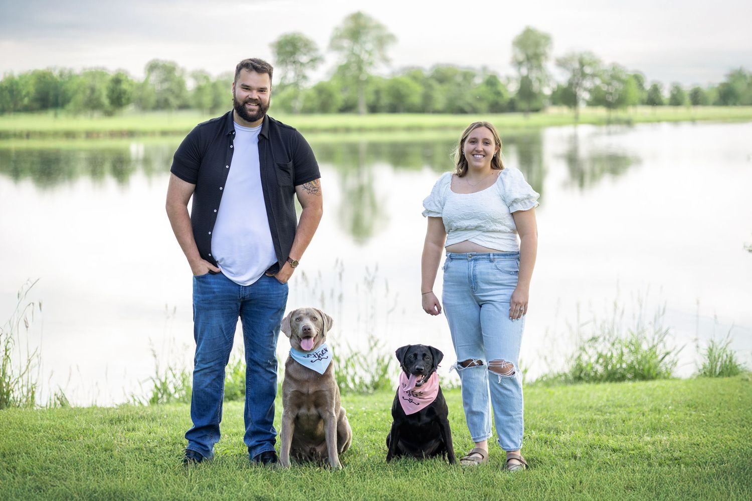 Springfield, IL photographer captures a couple smiling with their two dogs during a session in Central, IL
