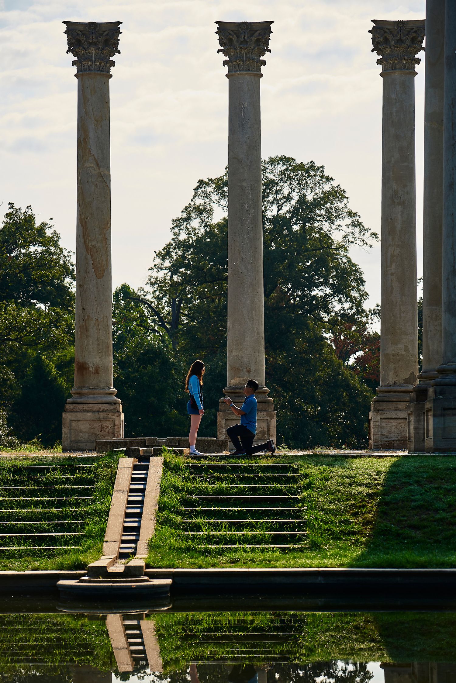 Surprise marriage proposal captured at the National Capitol Columns at the Arboretum in Washington DC.
