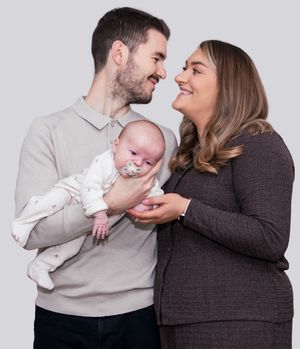A series of lifestyle photos showing tender moments with a newborn baby in a studio setting.