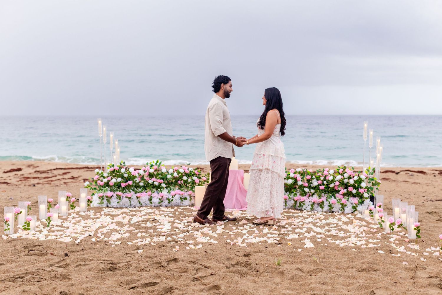 Marriage proposal on the beach with flowers and candles. Playa Guajataca, Isabela, Puerto Rico.