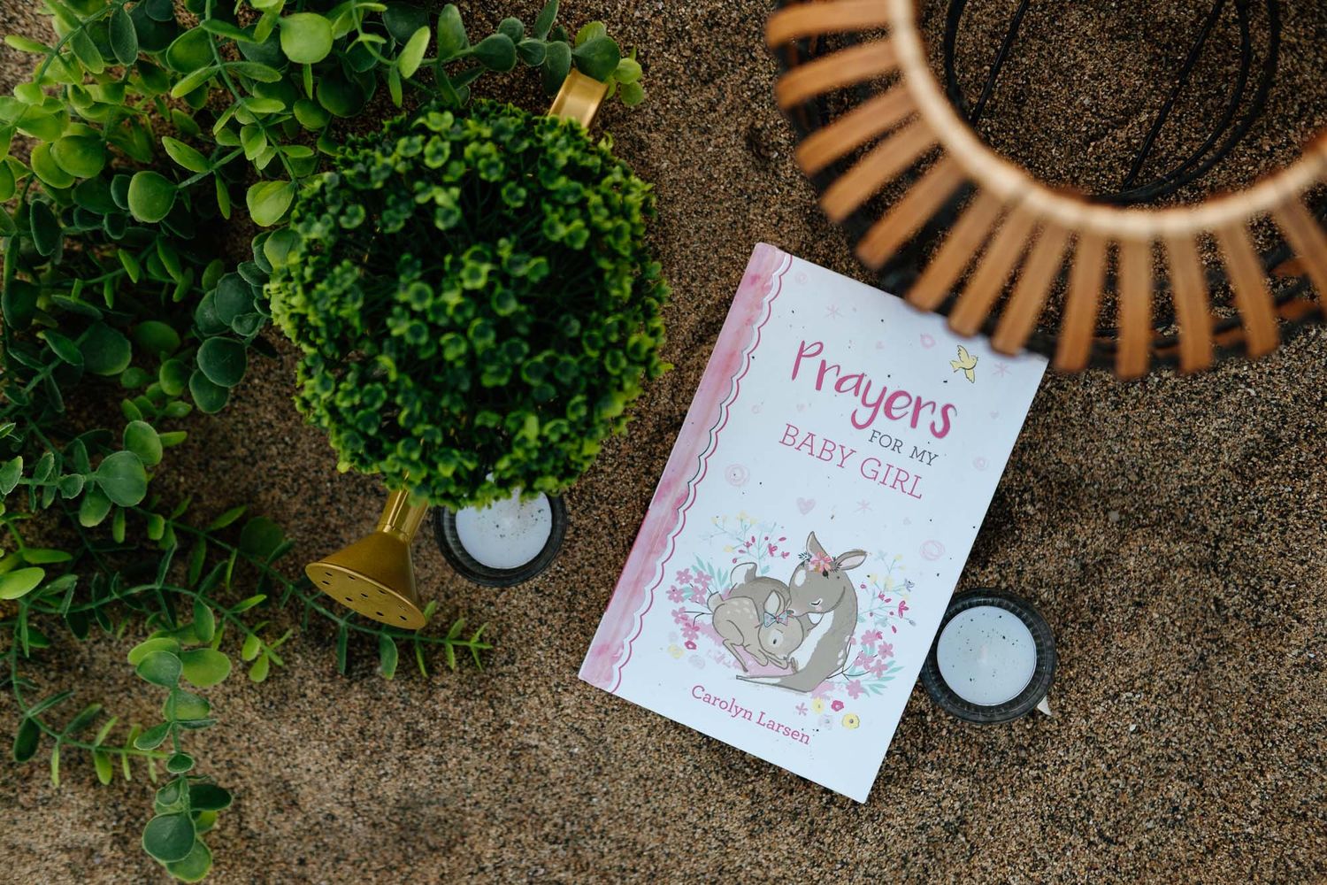 Personal details from a maternity photoshoot including a Bible and keepsake book for their baby girl