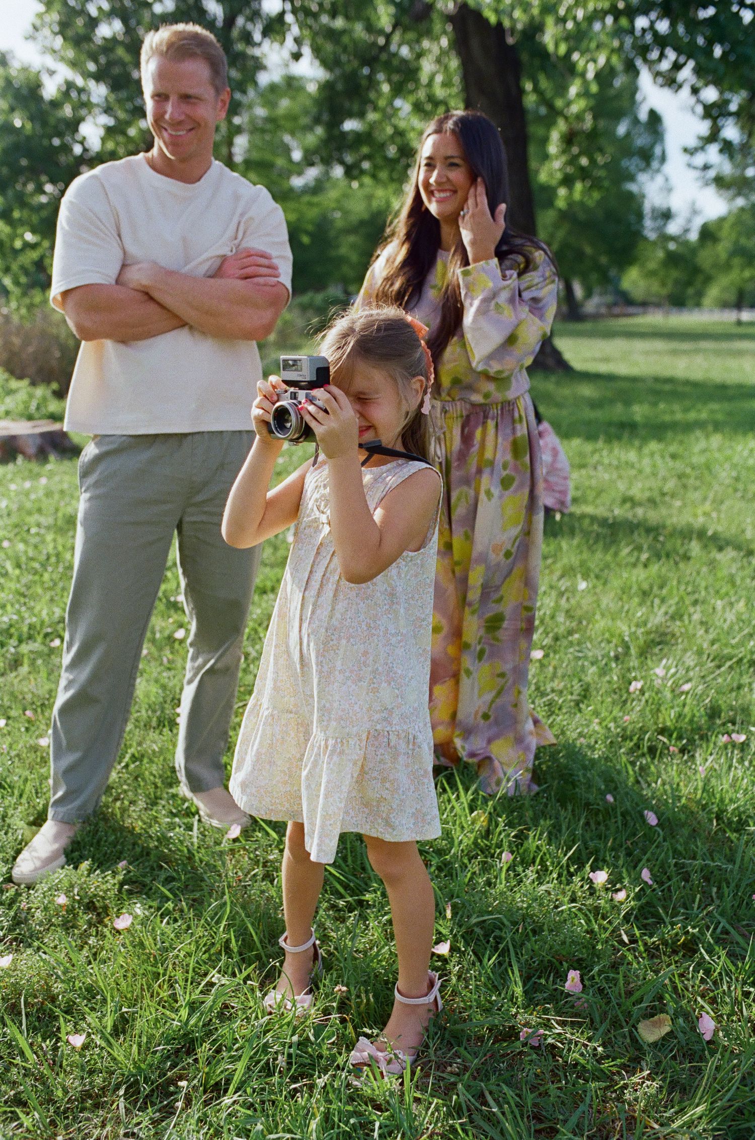 Parents with their children in a green field, film family portrait in Dallas