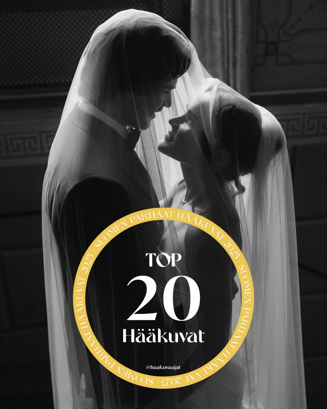 Black and white wedding photo of couple sharing intimate moment under veil, featured in Top 20 Hääkuvat.