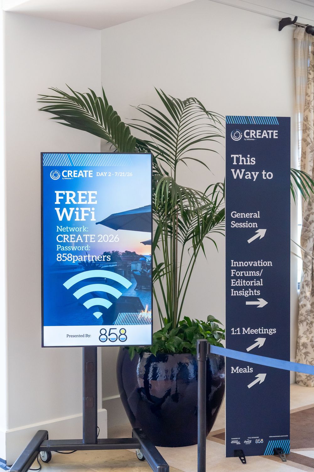 CREATE conference signage displaying free WiFi network details and directional arrows guiding attendees to sessions, forums, and meals.