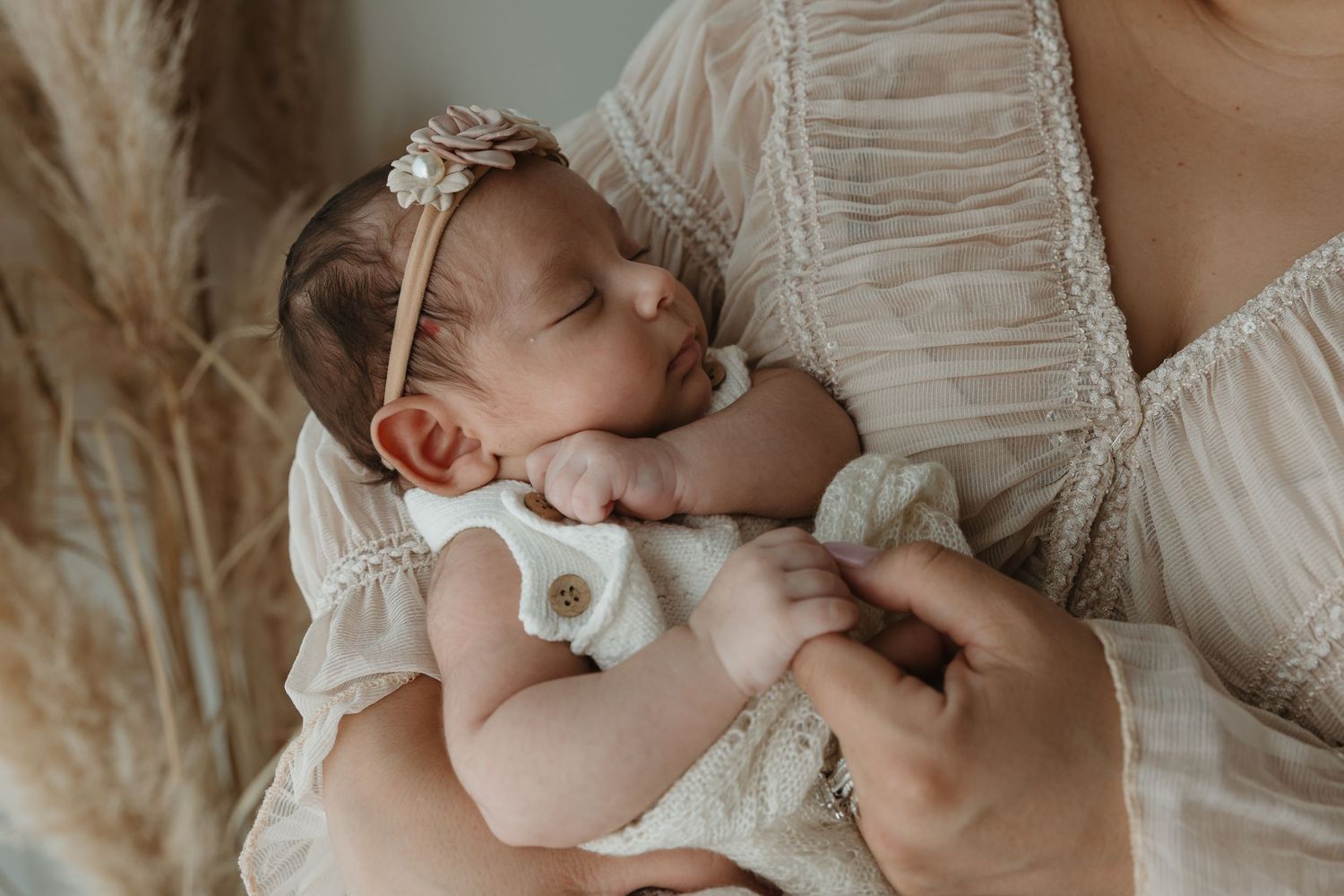 Detail shot of hands during newborn session with KP Portraits Embrace series in Tyler Tx studio