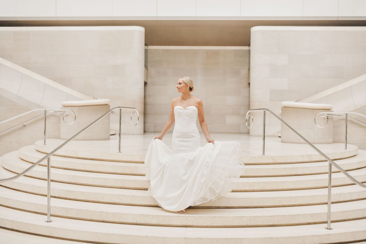 Architectural bridal portrait highlighting the grand interior of the Meyerson Symphony Center