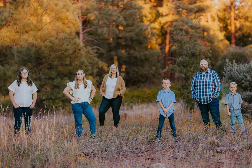 Family surrounded by autumn foliage