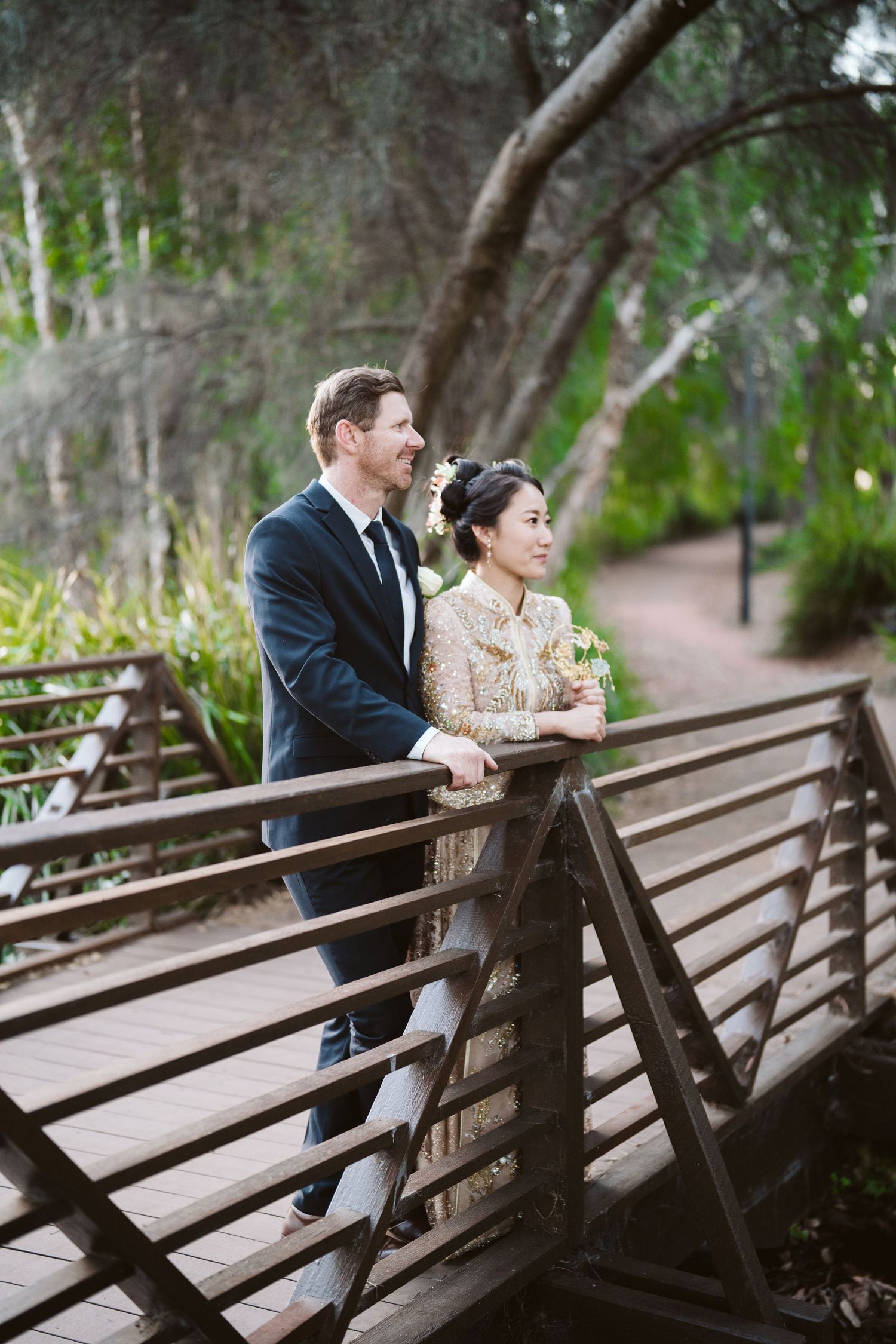 Cameron and Lulu on a wooden bridge in the park