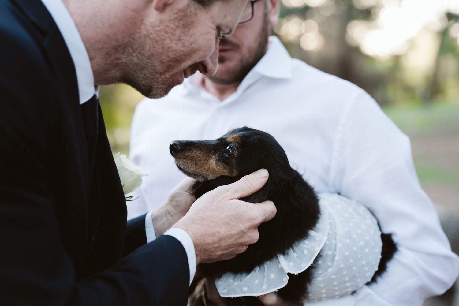 Cameron holding the couple's little dog