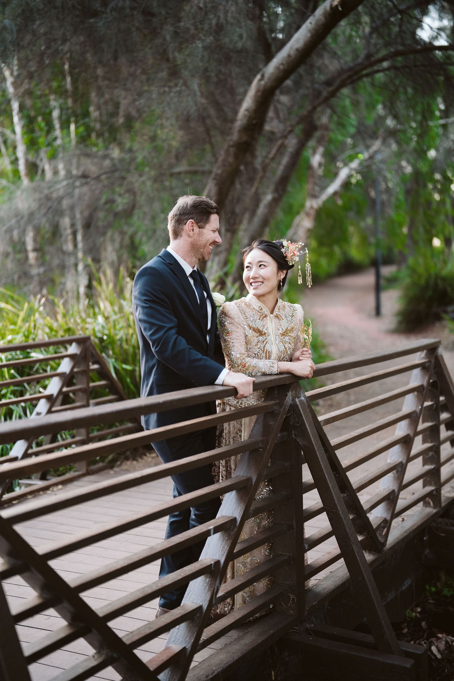 Cameron and Lulu on the bridge surrounded by greenery