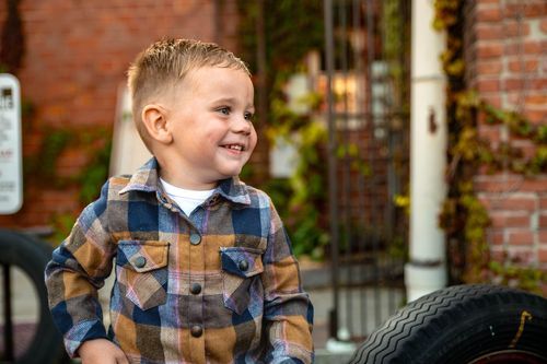 Toddler laughing during milestone session in West Central Ohio photo session.