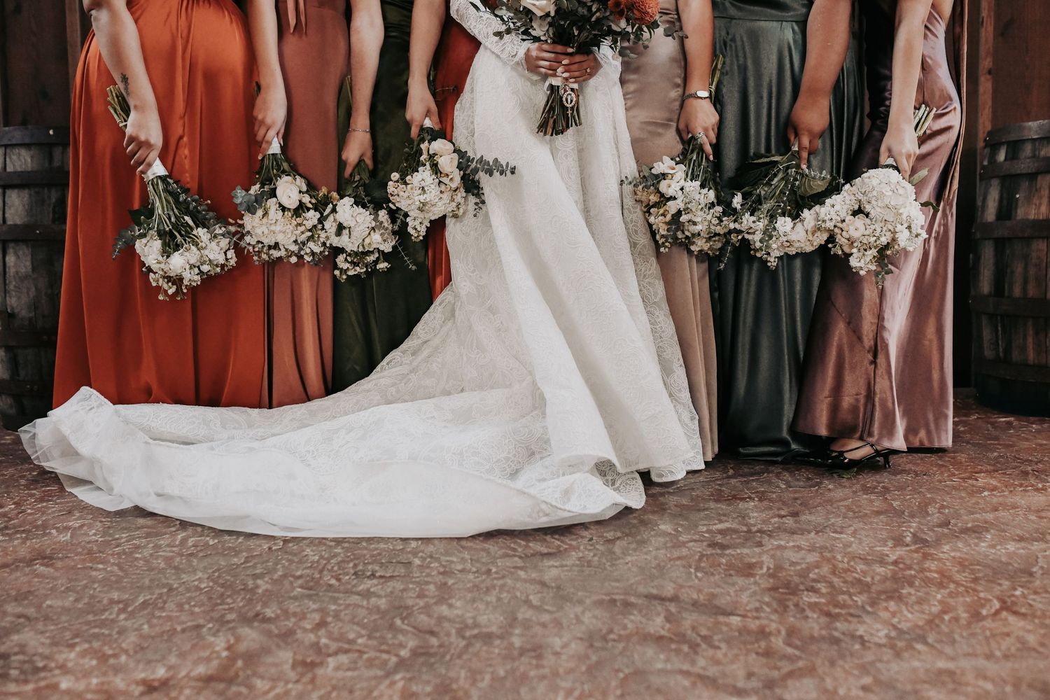Bridesmaids wearing rich fall colors for Texas wedding