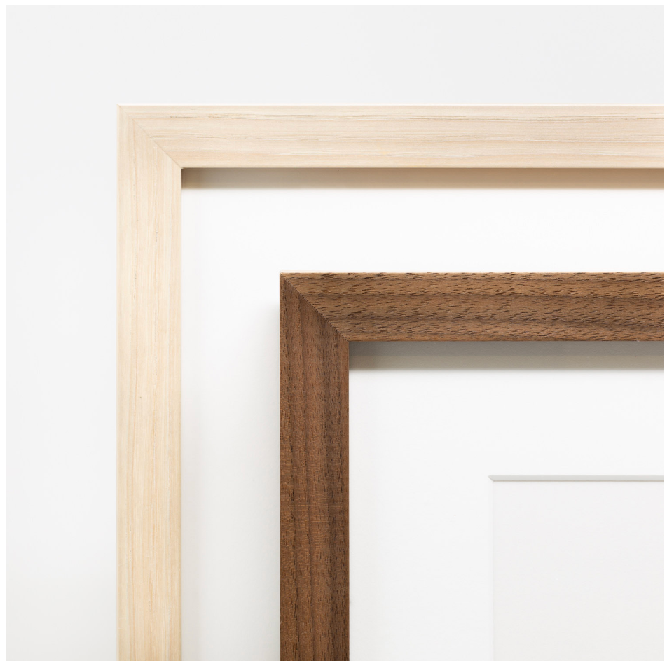 Two wooden picture frames, one light maple and one dark walnut, displayed together against a white background.