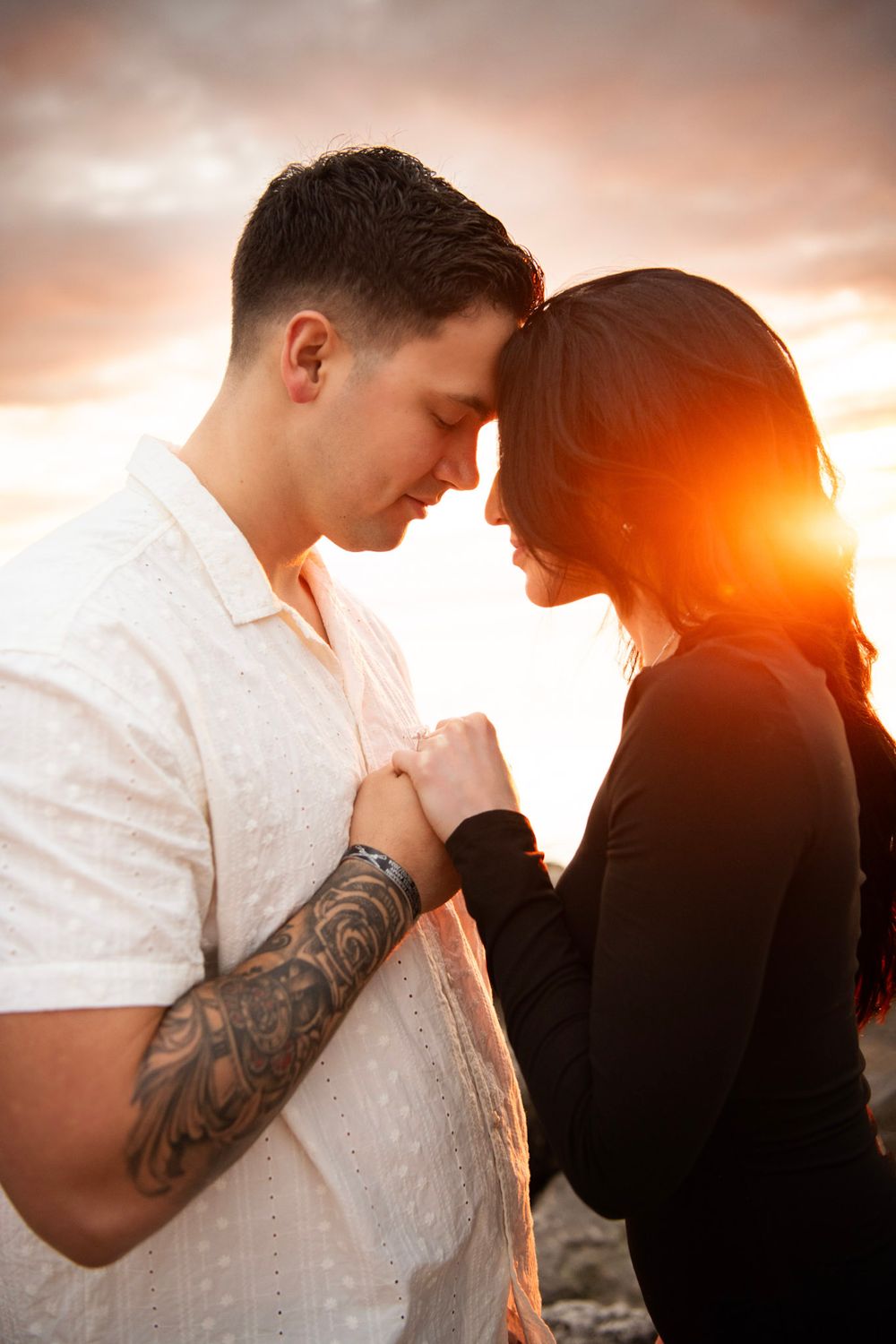 Romantic beach proposal photography in Clearwater, Florida capturing genuine emotion, soft ocean breezes, and golden skies.
