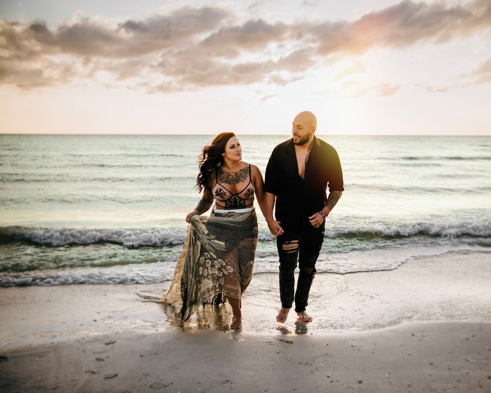 Sunset beach engagement-style photos in Dunedin, Florida capturing love, connection, and coastal beauty.