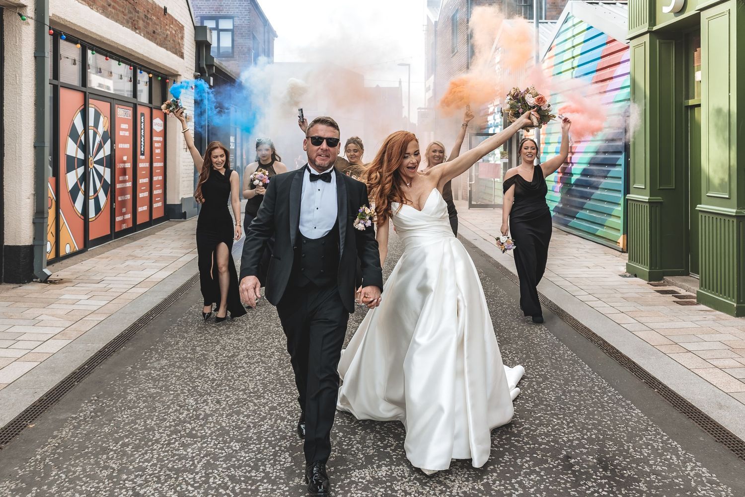 Natural fun wedding photos around Hull's Humber street after their ceremony at Guildhall
