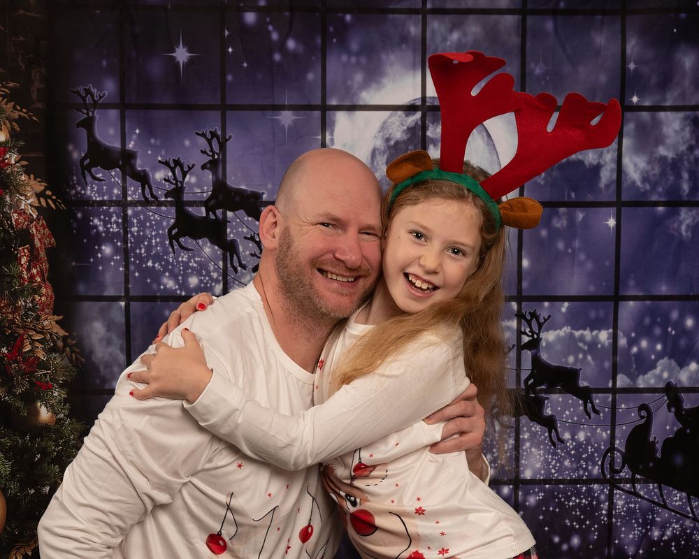 A series of four festive holiday photos showing people embracing and smiling in front of a decorated Christmas backdrop.
