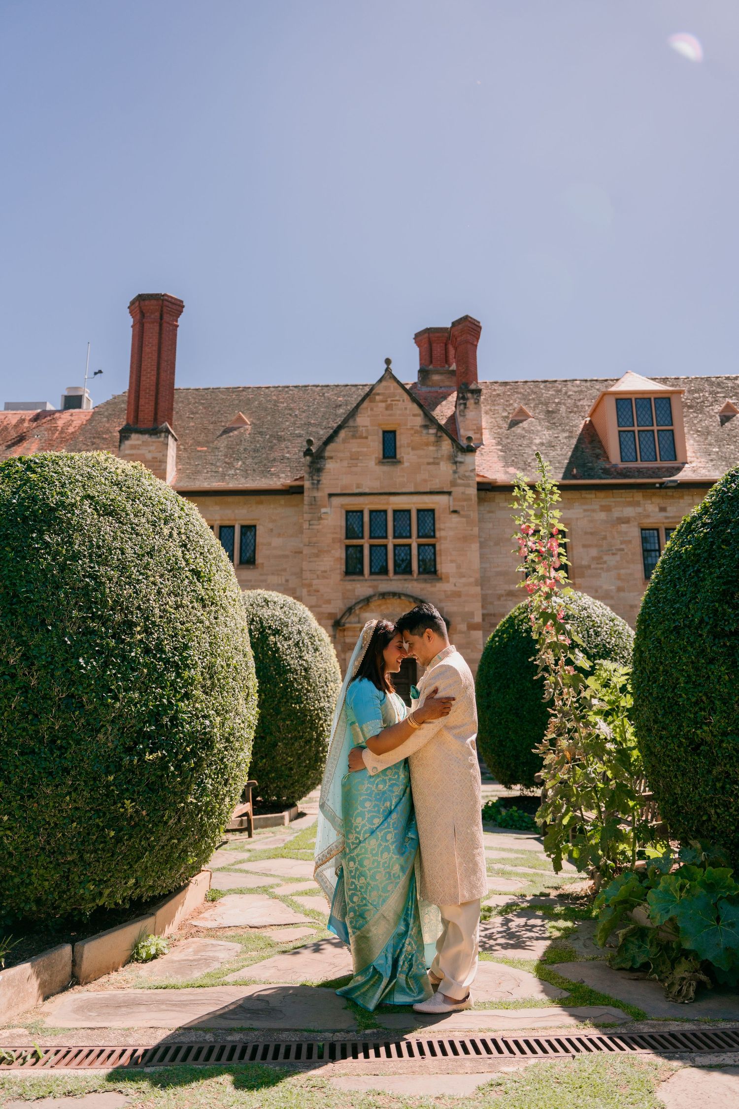 Couple portrait among the hedges at Carrick Hill, Adelaide engagement photoshoot