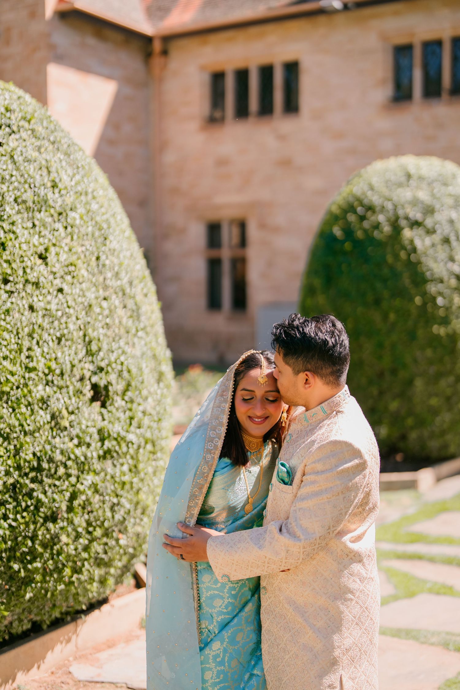 Pre-wedding couple photo in the formal hedge garden at Carrick Hill, Adelaide