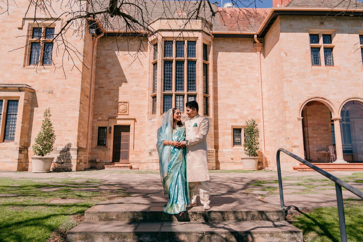 Couple on the steps of the Carrick Hill sandstone manor, Adelaide engagement photography