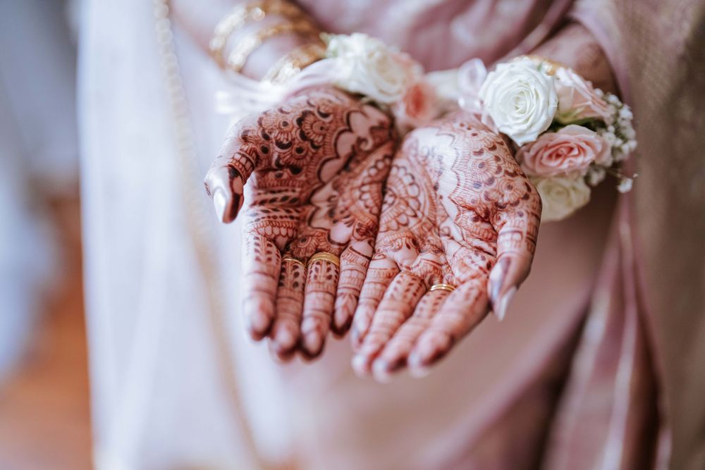Bridal Mehndi henna hands detail shot with floral wrist corsage - Sydney wedding details