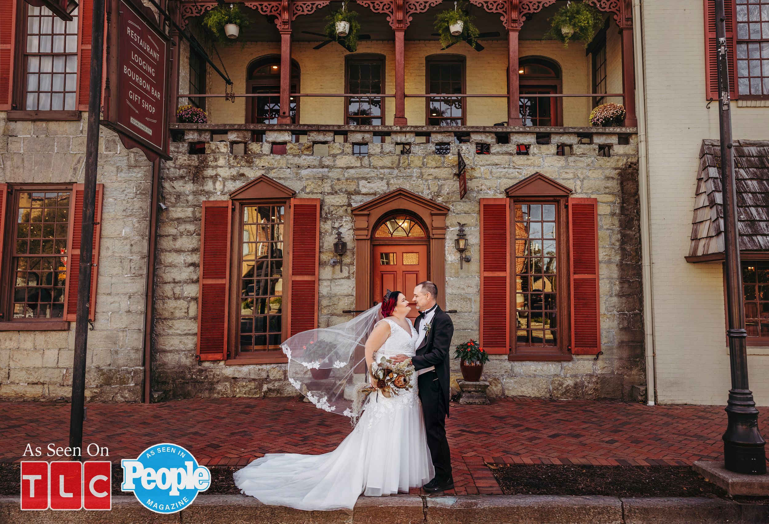 Amy Halterman and Brian Lovvorn on their wedding day posing in front of Talbott Tavern after their wedding ceremony